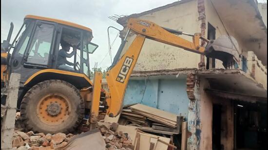 The engineering department of UT administration carried out an anti-encroachment drive in Sector 52 Kajheri on Monday, targeting unauthorised occupation on government land. (HT File)