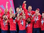  England's Jos Buttler holds aloft the trophy as they celebrate winning the T20 World Cup 