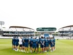 General view of England players and coaching staff in a huddle during practice 