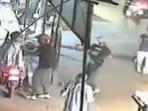 The two men snatch the bag, dragging the pillion rider on the road, and run away. (Twitter/Screengrab)