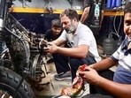 Rahul Gandhi can also be seen repairing a bike.