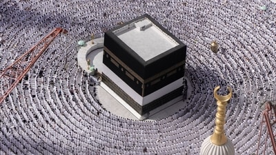 Muslim pilgrims pray around the Kaaba, the cubic building at the Grand Mosque, during the annual Hajj pilgrimage in Mecca, Saudi Arabia, on June 25. Muslim pilgrims are converging on Saudi Arabia's holy city of Mecca for the largest Hajj since the coronavirus pandemic severely curtailed access to one of Islam's five pillars. (Amr Nabil / AP) Muslim pilgrims pray around the Kaaba, the cubic building at the Grand Mosque, during the annual Hajj pilgrimage in Mecca, Saudi Arabia, on June 25. Muslim pilgrims are converging on Saudi Arabia's holy city of Mecca for the largest Hajj since the coronavirus pandemic severely curtailed access to one of Islam's five pillars. (Amr Nabil / AP)