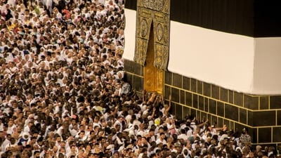 Thousands of pilgrims circumambulate around the Kaaba, the cubic building at the Grand Mosque, during the annual Hajj pilgrimage, in Mecca on June 25. Ayedh al-Ghweinim, a spokesman for the Saudi Hajj Ministry told AP, “More than 1.8 million pilgrims from all over the world have already amassed in and around Mecca for the Hajj, and the number was still growing as more pilgrims from inside Saudi Arabia joined” (Amr Nabil / AP) Thousands of pilgrims circumambulate around the Kaaba, the cubic building at the Grand Mosque, during the annual Hajj pilgrimage, in Mecca on June 25. Ayedh al-Ghweinim, a spokesman for the Saudi Hajj Ministry told AP, “More than 1.8 million pilgrims from all over the world have already amassed in and around Mecca for the Hajj, and the number was still growing as more pilgrims from inside Saudi Arabia joined” (Amr Nabil / AP)