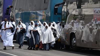 Muslim pilgrims arrive in Mina, near Islam's holy city of Mecca on June 26. Authorities have said they expect this year's numbers to approach pre-COVID levels of more than 2 million, reported AP. (Sajjad Hussain / AFP) Muslim pilgrims arrive in Mina, near Islam's holy city of Mecca on June 26. Authorities have said they expect this year's numbers to approach pre-COVID levels of more than 2 million, reported AP. (Sajjad Hussain / AFP)