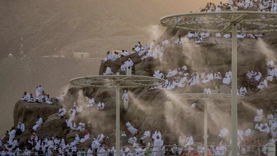 Water mist is sprayed on pilgrims as they pray on the rocky hill known as the Mountain of Mercy, on the Plain of Arafat, during the annual Hajj pilgrimage on June 27. High temperatures have been a constant challenge for the pilgrims, who come from around the world, the mercury hit 44 degrees Celsius (111 degrees Fahrenheit) before midday on the hajj's most physically demanding day, reported AFP. (Amr Nabil / AP) Water mist is sprayed on pilgrims as they pray on the rocky hill known as the Mountain of Mercy, on the Plain of Arafat, during the annual Hajj pilgrimage on June 27. High temperatures have been a constant challenge for the pilgrims, who come from around the world, the mercury hit 44 degrees Celsius (111 degrees Fahrenheit) before midday on the hajj's most physically demanding day, reported AFP. (Amr Nabil / AP)