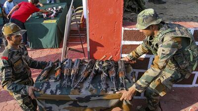 Army personnel display arms recovered after foiling an infiltration bid along the Line of Control (LoC) in Jammu and Kashmir’s Machil sector, Kupwara, on June 23. (PTI File Photo) Army personnel display arms recovered after foiling an infiltration bid along the Line of Control (LoC) in Jammu and Kashmir’s Machil sector, Kupwara, on June 23. (PTI File Photo)