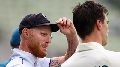England's Ben Stokes with Australia's Pat Cummins after Australia win the first Test (Reuters)