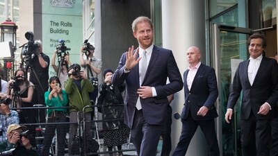 Prince Harry leaves the High Court after giving evidence in London. (AP)