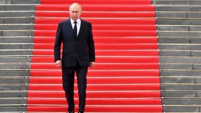 Russian president Vladimir Putin walks down the steps to address troops from the defence ministry. (AFP) Russian president Vladimir Putin walks down the steps to address troops from the defence ministry. (AFP)