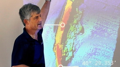 OceanGate CEO and co-founder Stockton Rush speaks in front of a projected image of the wreckage of the ocean liner SS Andrea Doria during a presentation on their findings after an undersea exploration, on June 13, 2016, in Boston (AP Photo/Bill Sikes, File) (AP)