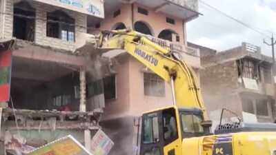 Fatehpur administration demolishes the house of a rape accused in the presence of police. (ANI)