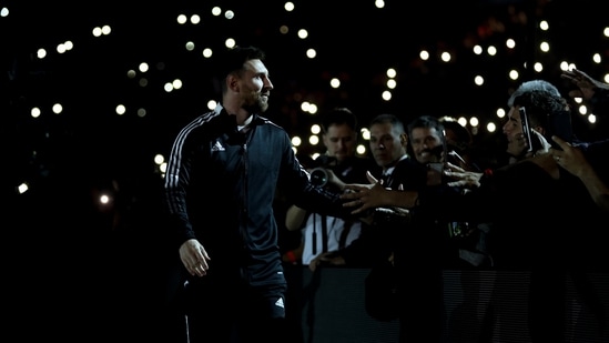 Argentina soccer player Lionel Messi greets fans (AP)