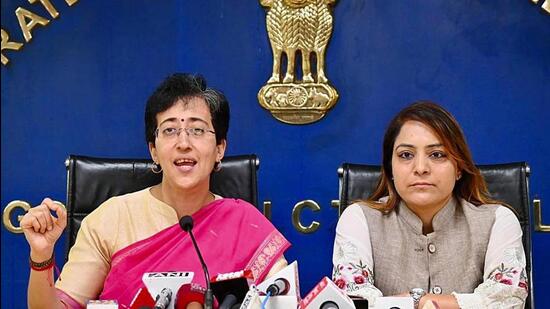 Delhi education minister Atishi with Delhi mayor Shelly Oberoi at Delhi Secretariat in New Delhi on Tuesday. (HT photo)