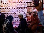 People shop at a market ahead of Eid People shop at a market ahead of Eid