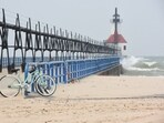 A haze falls over Lake Michigan and the St. Joseph Lighthouses Tuesday, June 27, 2023, along Tiscornia Beach in St. Joseph, Mich., as wildfires continue to burn in Canada. (Don Campbell/The Herald-Palladium via AP) A haze falls over Lake Michigan and the St. Joseph Lighthouses Tuesday, June 27, 2023, along Tiscornia Beach in St. Joseph, Mich., as wildfires continue to burn in Canada. (Don Campbell/The Herald-Palladium via AP)