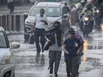 Commuters out in the rain at Delhi’s Pandav Nagar. (Raj K Raj/HT Photo) Commuters out in the rain at Delhi’s Pandav Nagar. (Raj K Raj/HT Photo)