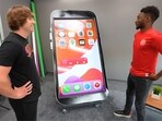 Marques Brownlee (MKBHD) reviewing the 8 feet tall fully-functional ‘iPhone’ created by YouTuber Matthew Beem and team. Marques Brownlee (MKBHD) reviewing the 8 feet tall fully-functional ‘iPhone’ created by YouTuber Matthew Beem and team.
