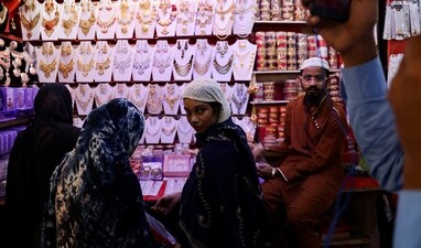 People shop at a market ahead of Eid People shop at a market ahead of Eid