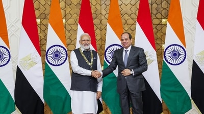 Prime Minister Narendra Modi being conferred with the highest state honour of Egypt', the Order of the Nile’ award, by Egyptian President Abdel Fattah El-Sisi, at President House, in Cairo on Sunday. (ANI Photo)