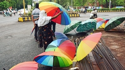 A roadside vendor waits for customers to sell umbrellas during monsoon season, in Nagpur. (Chandrakant Paddhane) A roadside vendor waits for customers to sell umbrellas during monsoon season, in Nagpur. (Chandrakant Paddhane)
