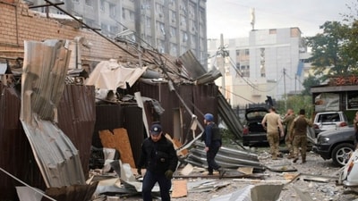 A police officer and a rescue worker walk in front of a restaurant RIA Pizza destroyed by a Russian attack in Kramatorsk, Ukraine, Tuesday, June 27. (AP) A police officer and a rescue worker walk in front of a restaurant RIA Pizza destroyed by a Russian attack in Kramatorsk, Ukraine, Tuesday, June 27. (AP)