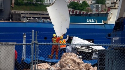 Debris from the Titan submersible, recovered from the ocean floor near the wreck of the Titanic, is unloaded from the ship Horizon Arctic at the Canadian Coast Guard pier in St. John's, Newfoundland. (AP) Debris from the Titan submersible, recovered from the ocean floor near the wreck of the Titanic, is unloaded from the ship Horizon Arctic at the Canadian Coast Guard pier in St. John's, Newfoundland. (AP)