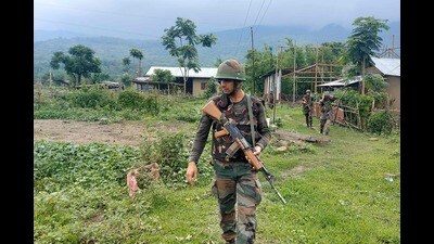Army personnel patrol during a combing operation at Kanto Sabal village near Imphal. (AFP) Army personnel patrol during a combing operation at Kanto Sabal village near Imphal. (AFP)