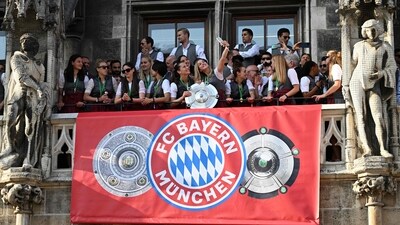 Bayern Munich's men's and women's teams celebrate on the balcony of city hall at Marienplatz in Munich (AFP) Bayern Munich's men's and women's teams celebrate on the balcony of city hall at Marienplatz in Munich (AFP)
