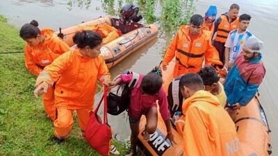 This undated photograph provided by National Disaster Response Force (NDRF) shows NDRF personnel rescuing flood affected people in north eastern Assam state. (NDRF via AP) This undated photograph provided by National Disaster Response Force (NDRF) shows NDRF personnel rescuing flood affected people in north eastern Assam state. (NDRF via AP)