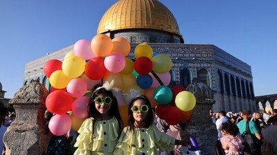 Muslim worshippers gather at the al-Aqsa mosque compound in Jerusalem's Old City during Eid Al-Adha morning prayers on June 28. (AFP) Muslim worshippers gather at the al-Aqsa mosque compound in Jerusalem's Old City during Eid Al-Adha morning prayers on June 28. (AFP)