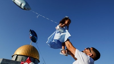 Palestinians celebrate the first day of the Muslim holiday of Eid al-Adha in the Al-Aqsa compound also known to Jews as the Temple Mount in Jerusalem's Old City. (REUTERS)