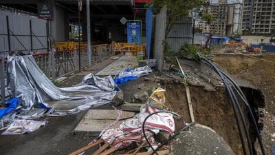 Road next to Magathane metro station caved in on Tuesday. (Satish Bate/HT Photo) Road next to Magathane metro station caved in on Tuesday. (Satish Bate/HT Photo)
