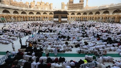 Muslim pilgrims gather around the Kaaba, Islam's holiest shrine, as they perform Eid-ul-Adha morning prayers in Mecca. (AFP) Muslim pilgrims gather around the Kaaba, Islam's holiest shrine, as they perform Eid-ul-Adha morning prayers in Mecca. (AFP)
