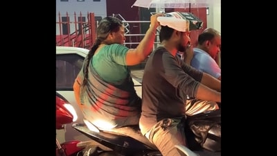Viral Video: Mom protecting son from rain. (Instagram/@wils_pat) Viral Video: Mom protecting son from rain. (Instagram/@wils_pat)