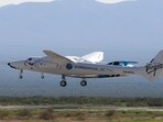 Virgin Galactic's passenger rocket plane VSS Unity, borne by twin-fuselage carrier jet dubbed VMS Eve. 