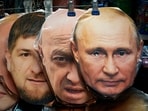 Face masks depicting Russian President Vladimir Putin, right, owner of private military company Wagner Group Yevgeny Prigozhin, centre, and Chechnya's regional leader Ramzan Kadyrov, left, are displayed among others for sale at a souvenir shop in St. Petersburg, Russia.