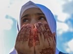 A Muslim devotee offers Eid al-Adha prayers on Thursday.