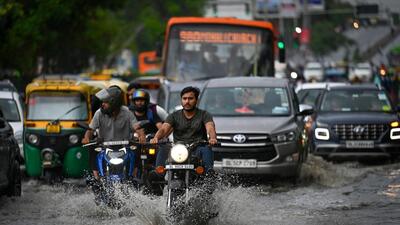 A waterlogged stretch of a road after rain at Moti Nagar in New Delhi on Thursday. (Sanchit Khanna/HT Photo)