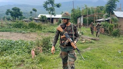 Army personnel patrol during a combing operation at Kanto Sabal village near Imphal. (AFP)