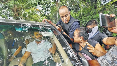 Congress leader Rahul Gandhi waits inside a car after his convoy was stopped by police, in Bishnupur, on Thursday. (PTI) Congress leader Rahul Gandhi waits inside a car after his convoy was stopped by police, in Bishnupur, on Thursday. (PTI)