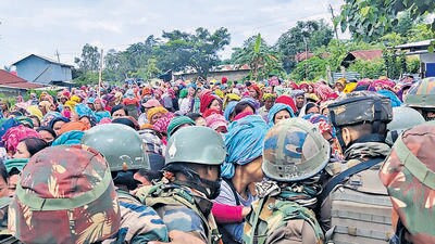 Crowds at the site of the firing in Manipur’s Harothel village. (HT photo) Crowds at the site of the firing in Manipur’s Harothel village. (HT photo)