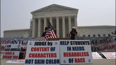 Education supporters demonstrate outside the US Supreme Court in Washington, DC, on Thursday. (AFP) Education supporters demonstrate outside the US Supreme Court in Washington, DC, on Thursday. (AFP)