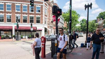 People walk around Harvard Square in Cambridge, Massachusetts, on Thursday. (AFP) People walk around Harvard Square in Cambridge, Massachusetts, on Thursday. (AFP)