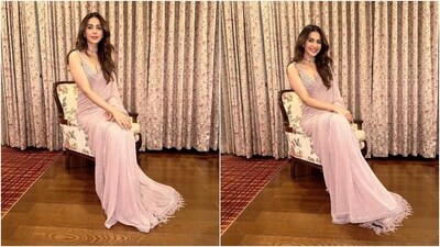 Rakul accessorised the saree and the blouse set with statement rings and a choker necklace featuring matching pink beads. Lastly, Rakul chose centre-parted open wavy locks, fuchsia pink lip shade, winged eyeliner, mascara on the lashes, darkened brows, rouged cheekbones, a dewy base, and light contouring. (Instagram) Rakul accessorised the saree and the blouse set with statement rings and a choker necklace featuring matching pink beads. Lastly, Rakul chose centre-parted open wavy locks, fuchsia pink lip shade, winged eyeliner, mascara on the lashes, darkened brows, rouged cheekbones, a dewy base, and light contouring. (Instagram)