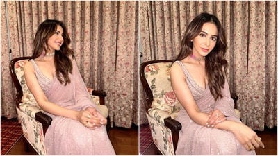 Rakul wore a blush pink saree for the photoshoot. The six yards come decked in shimmering sequin embellishments, gota patti embroidered borders, scalloped lace on the trims, and beaded tassel embellishments on the pallu. She wore the drape with a matching blush pink sleeveless blouse featuring a plunging neckline, sequin work, and heavy adornments. (Instagram) Rakul wore a blush pink saree for the photoshoot. The six yards come decked in shimmering sequin embellishments, gota patti embroidered borders, scalloped lace on the trims, and beaded tassel embellishments on the pallu. She wore the drape with a matching blush pink sleeveless blouse featuring a plunging neckline, sequin work, and heavy adornments. (Instagram)