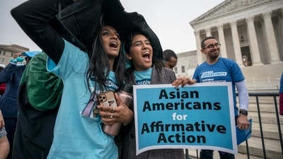FILE - Harvard students Shruthi Kumar, left, and Muskaan Arshad, join a rally with other activists as the Supreme Court hears oral arguments on a pair of cases that could decide the future of affirmative action in college admissions, in Washington, Oct. 31, 2022. (AP Photo/J. Scott Applewhite, File) (AP)