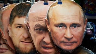 Face masks depicting Russian President Vladimir Putin, right, owner of private military company Wagner Group Yevgeny Prigozhin, centre, and Chechnya's regional leader Ramzan Kadyrov, left, are displayed among others for sale at a souvenir shop in St. Petersburg, Russia.