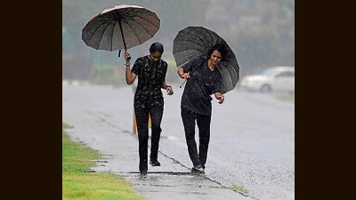 Youngsters enjoying the first rains of the season in Ludhiana. (HT PHOTO) Youngsters enjoying the first rains of the season in Ludhiana. (HT PHOTO)