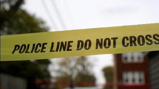 Yellow police tape is displayed at a crime scene after a motorist was shot in the head along the 2700 block of south 80th Street in Chicago, Illinois, U.S., November 1, 2017. REUTERS/Joshua Lott/Files