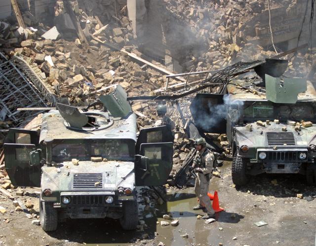 US Army troops in the Iraqi capital of Baghdad on April 26, 2004. The US troops, who were at a chemical storehouse that exploded in Baghdad appeared to have included members of the Iraq Survey Group (ISG) hunting for weapons of mass destruction. (Ceerwan Aziz CLH/REUTERS)